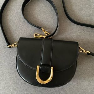 Charles & Keith Gabine Leather Saddle Bag in Black
